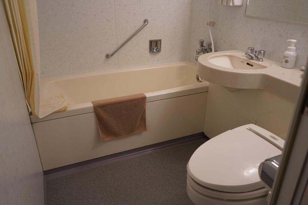 a bathroom with a tub sink and toilet