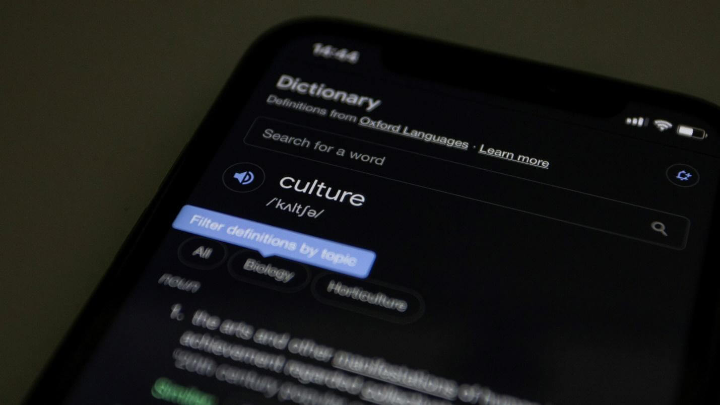 a close up of a cell phone with a dictionary on the screen